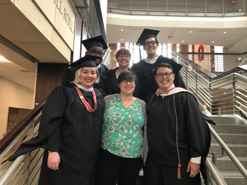 2018 Graduates of the OSU HESA Program (Ada, Marcell, Elyssa, Cat) pose on the staircase in the Ohio Union, alongside C. and Kristen.