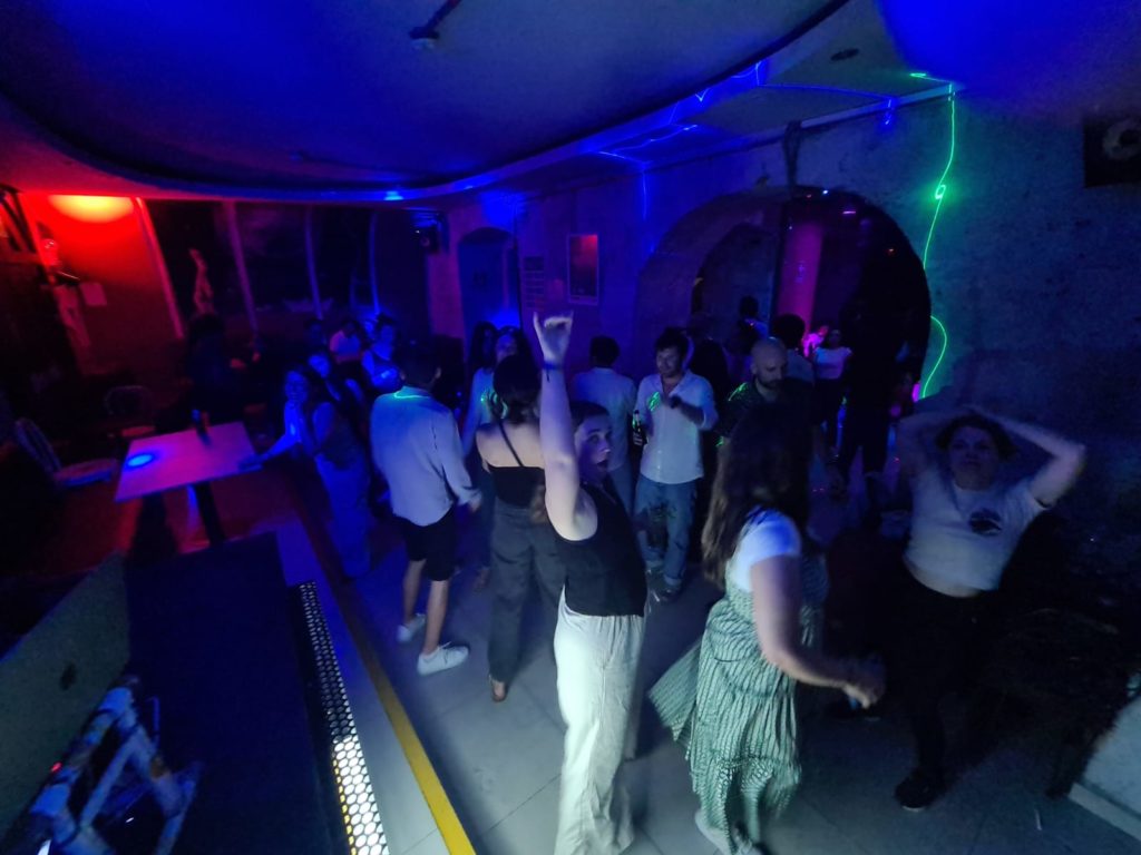 Photo of Ada's Peru travel group dancing in a disco in Arequipa, Peru.