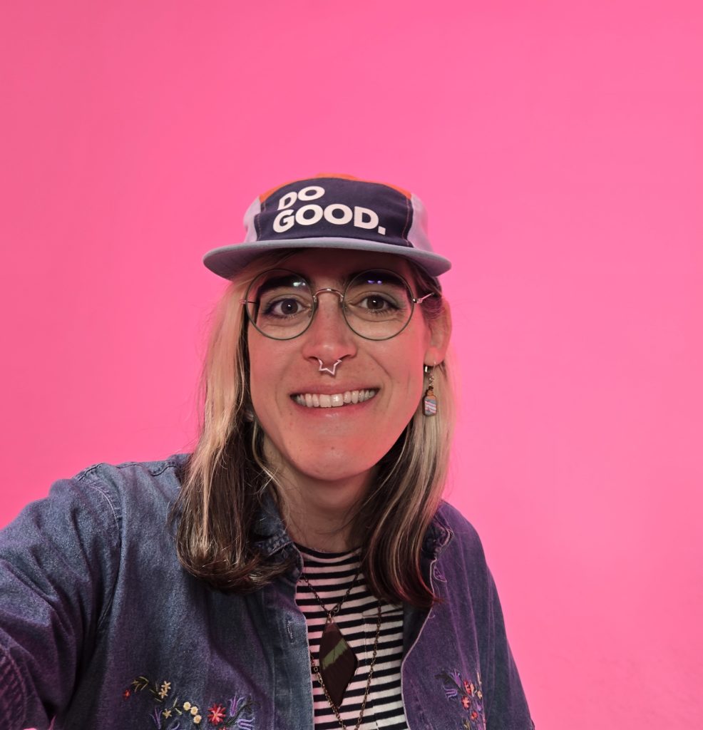 Photo of Ada in front of a well-lit pink backdrop