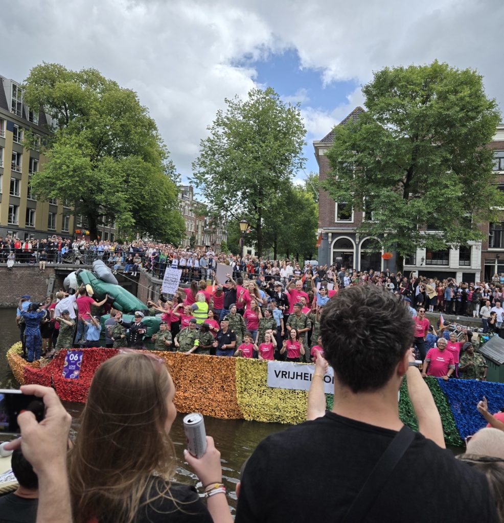 Photo of a the Dutch Military canal float in the Amsterdam Pride Parade in 2025.